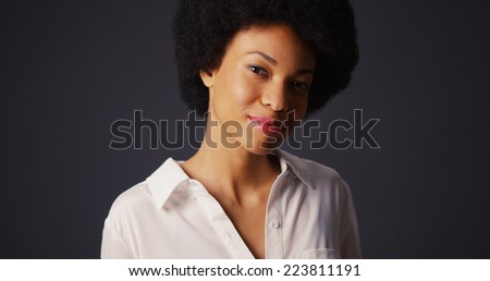 Portrait of black woman with afro and white blouse