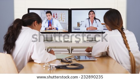 Mixed race team of medical doctors having a video conference