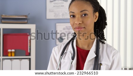 Close up of Black woman doctor looking at camera