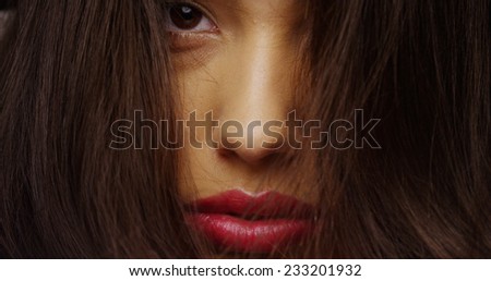 Hispanic woman with messy hair