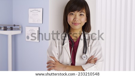 Chinese doctor standing in office