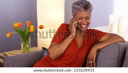 African grandmother talking on smartphone
