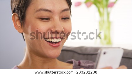 Asian woman browsing the web on smartphone