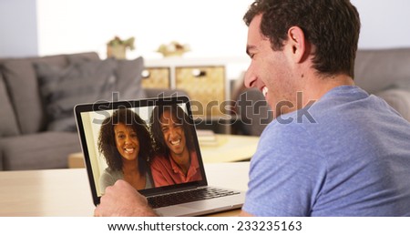 Diverse friends videochatting on laptop