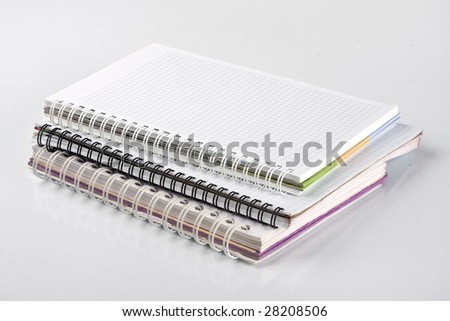 Three school notebooks with spiral binding