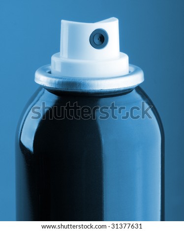 Macro of aerosol spray can colored  in blue