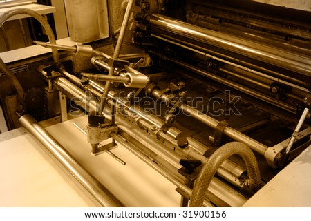 Old offset press machine in printing house