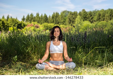 girl doing yoga outdoor with closed eyes, ladscape