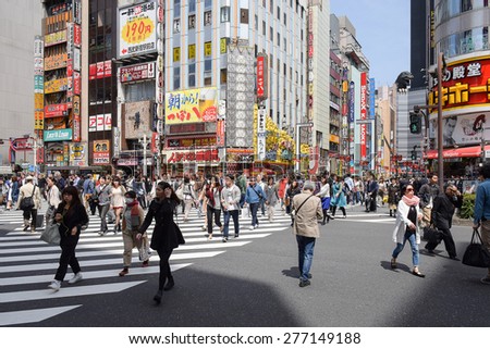 Tokyo, Japan - April 18, 2015: Pedestrians walk at Kabuki-cho district. The area is a entertainment and nightlife district known as Sleepless Town in Tokyo.