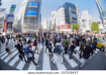 Blur image of pedestrians walk at Shibuya district in Tokyo, Japan with fisheye view effect