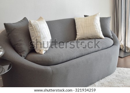 white and gray decorative pillow on a casual sofa in the living room