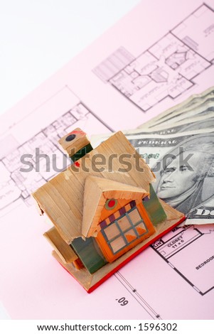 House and dollar bills on home plan background