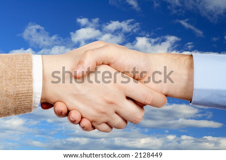 Business handshake over a sky background