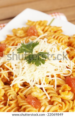Freshly cooked plate of fusilli pasta with tomato sauce just for eating. Shallow depth of field