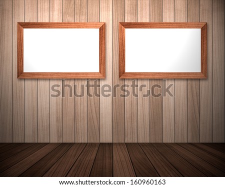 Empty photo frames on wood wall