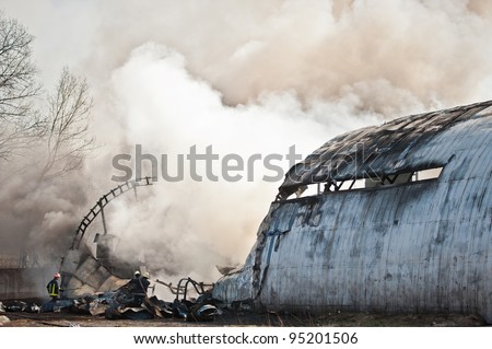 Smoke and steam rising from remains of a large aircraft after crashing