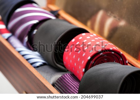 Display of different patterns and colours of man ties in a shop or showroom
