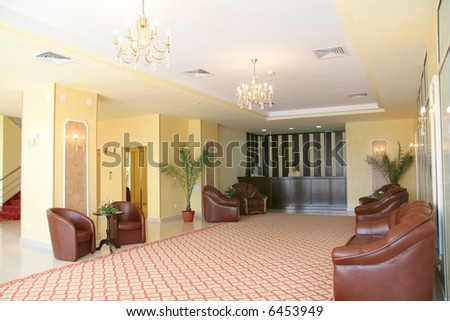Hotel reception: modern design, receptionist, indoor