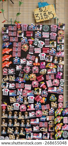 Singapore City, Singapore - June 22, 2014: Collection of fridge magnets for sale at the chinatown district in Singapore.