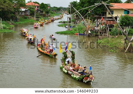 AYUTTHAYA, THAILAND - JULY 26: Top view of Beautiful flower boats in floating parade, the unique annual candle festival of Buddhist lent on July 26, 2010 in Ladchado, Ayutthaya, Thailand