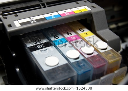 close-up shot of a CMYK ink cartridges for a color printer shallow depth of field