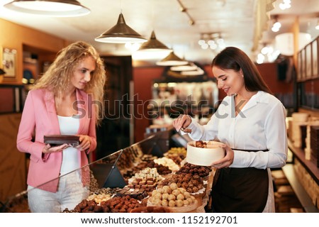 Similar – Image, Stock Photo Woman buying sweets in cupcakery