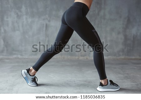 Similar – Image, Stock Photo Black pants, sneakers, legs stand with shadow on pavement