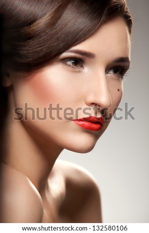 Close-up portrait of sexy young model with glamour red lips make-up