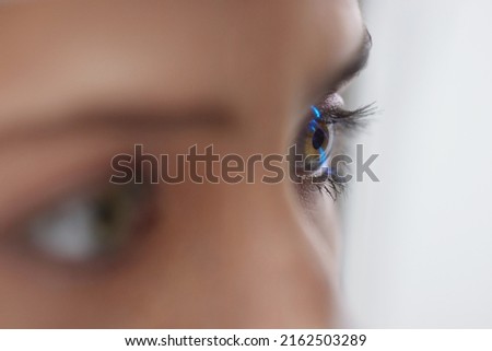 Eyesight Exam. Woman Checking Eye Vision On Optometry Equipment. Close Up View of Girl Checking Eyesight with Virtual Laser in a Clinic. Medicine and Health Concept  Stok fotoğraf © 
