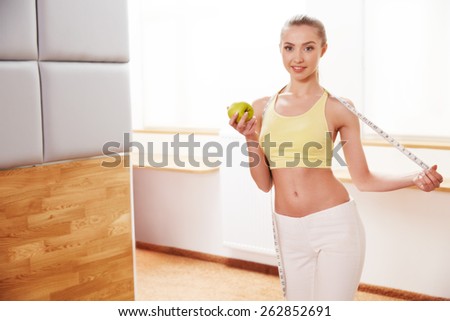 Diet. Dieting concept. Healthy Food. Beautiful Young Woman with Apple