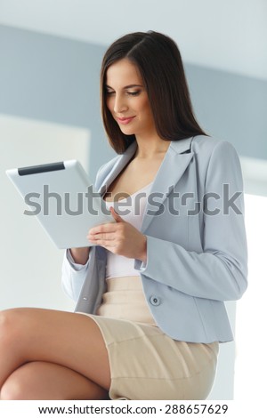 Tablet computer. Business woman with digital tablet computer