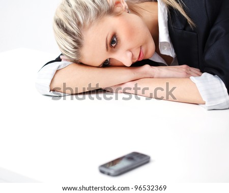 Closeup  Portrait Of  business woman waiting for call over white background