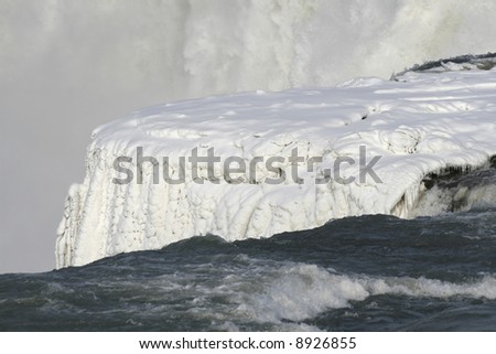 Frozen detail of Niagara Falls; winter, snow theme
