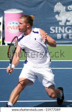 Tennis Backhand Volleys- Alex Bogomolov of Russia playing in a qualifying round of the Leggmason Classic Tournament of the US Open Series, August 9, 2008
