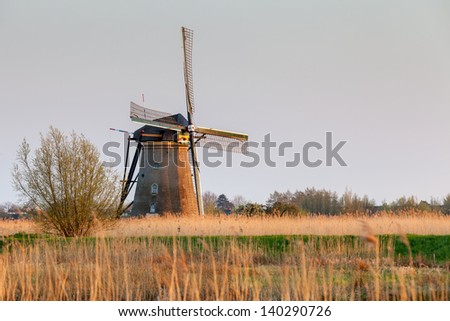 Windmill near Kinderdijk at sunset, South Holland, Netherlands