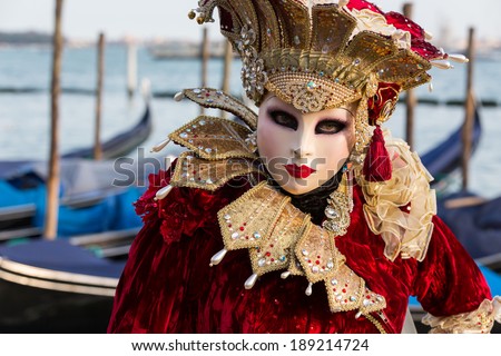 VENICE - FEBRUARY 21: Venetian costumed woman during venetian carnival on February 21, 2014 in Venice, Italy. This year the Carnival was held between February 15 - March 4.