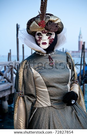 VENICE, ITALY - FEB 28: Unidentified person in carnival costume poses at Venice carnival on Feb 28, 2011 in Venice. Venice is one of the world\'s top places to celebrate carnival.