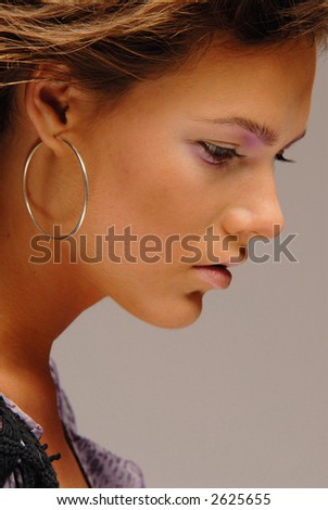 Close-up portrait of a young attractive woman side view