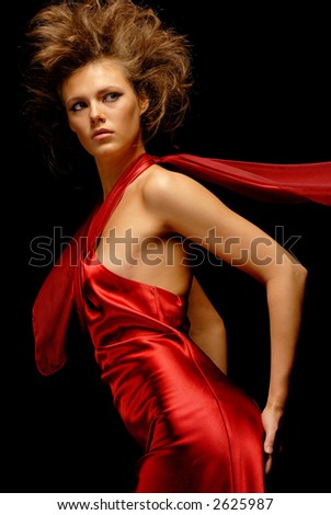 Portrait of a woman in a red satin dress side view