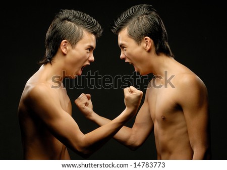 Twin brothers yelling at each other clenching fists