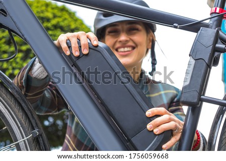 Similar – Image, Stock Photo Woman holding a charging cable in her hand