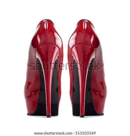 a pair of red women\'s shoes with high heels isolated on a white background
