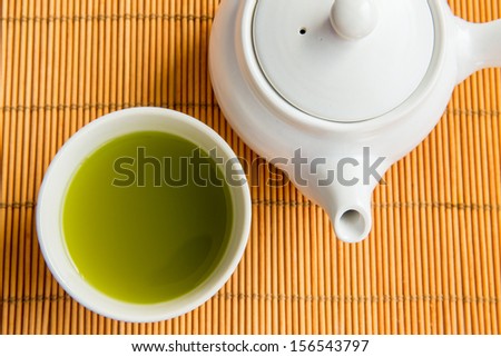 Asian Green tea set on bamboo mat(Green tea and chopsticks)