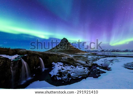 Mountain Kirkjufell and Aurora in Iceland.