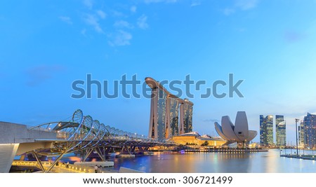 SINGAPORE - FEBRUARY 19:The Helix bridge with Marina Bay Sands on Feb 19, 2014 in Singapore. It is a pedestrian bridge linking Marina Centre with Marina South in the Marina Bay area in Singapore.