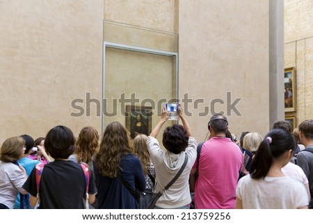 PARIS, FRANCE, August 6, 2014: People waiting on queue to see the Mona Lisa painting at the Louvre Museum (Musee du Louvre) on August 6, 2014 in Paris, France.