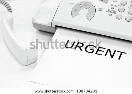 fax machine with urgent letter on document
