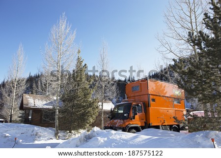 BRECKENRIDGE, COLORADO, USA - March 20: Camping with custom orange RV truck  on March 20, 2014 at Breckenridge ski village, Colorado, USA.