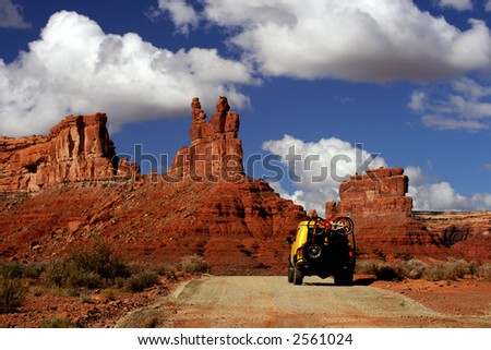 Yellow Van with Mountain bikes in Valley of Gods, Utah