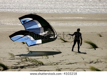 Man with wake board kite